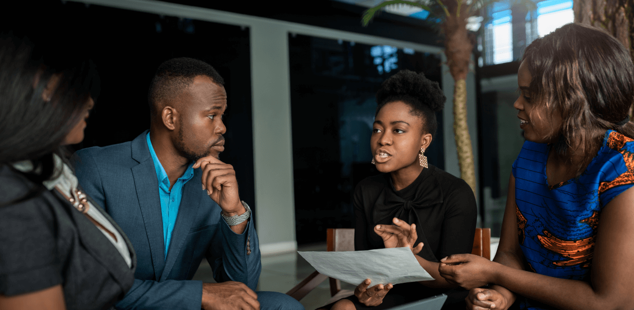 Strategic Pivot: Reprioritizing Third-Party Risk Management A focused risk team engaged in a meeting, strategizing about reprioritizing their Third-Party Risk Management Program.